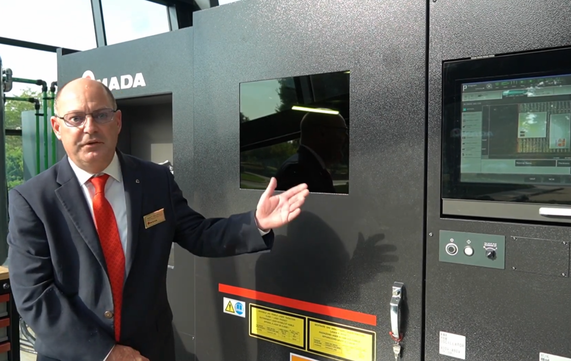 Matt Milazzo in front of the AMADA ORSUS 3015 AJe.