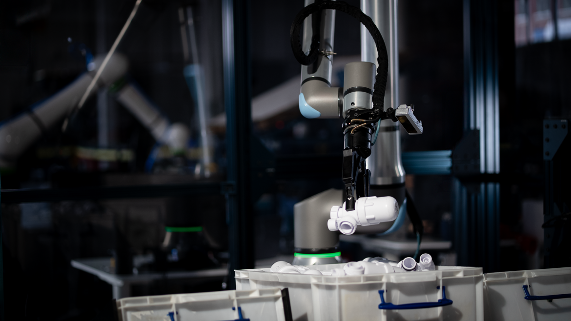 Photo of a robot picking a part autonomously